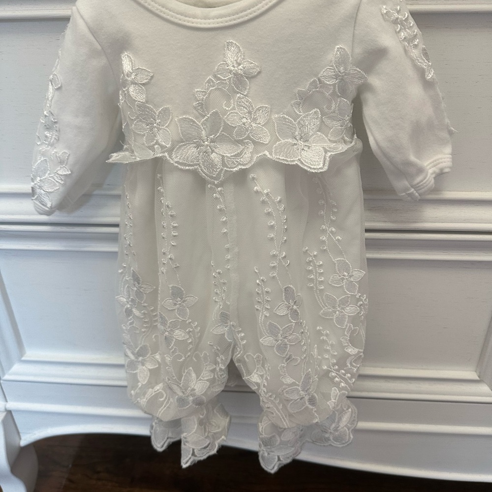 Bebe Gabrielle after christening changing outfit.  White floral lace romper